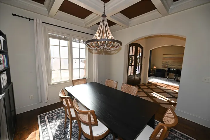 Perfected with coffered ceiling and beaded chandelier.