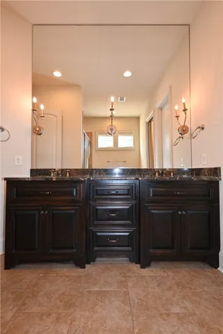 Primary bathroom has dual vanities.