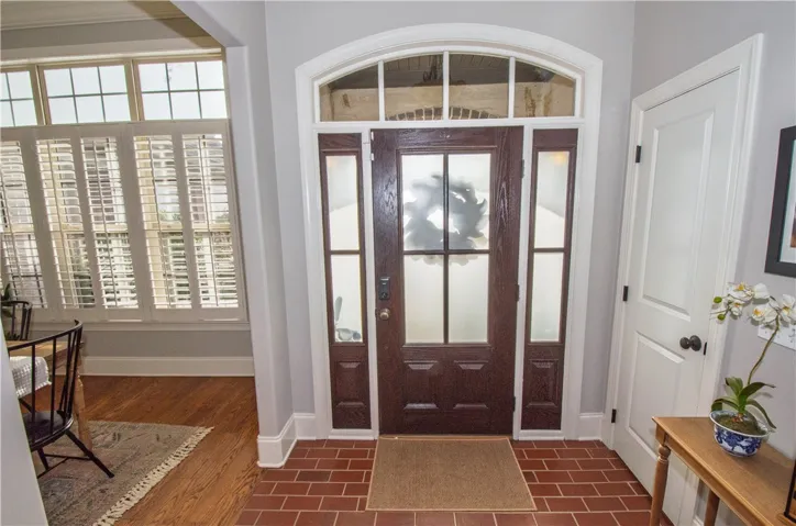 warm brick flooring in foyer sets the stage!