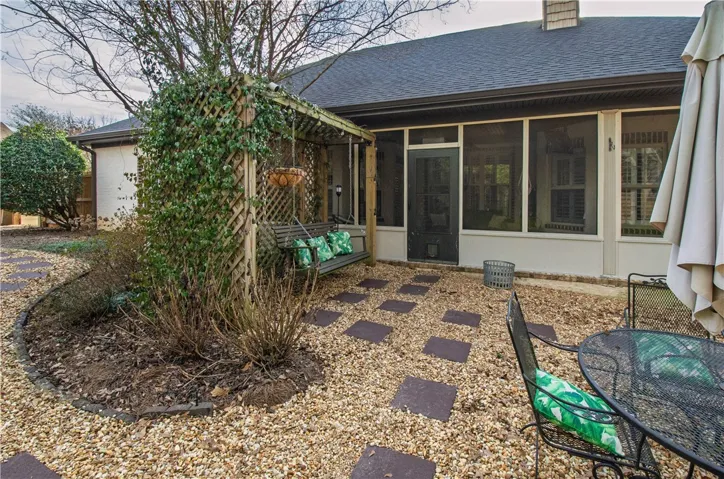 Garden arbor swing overlooking the backyard
