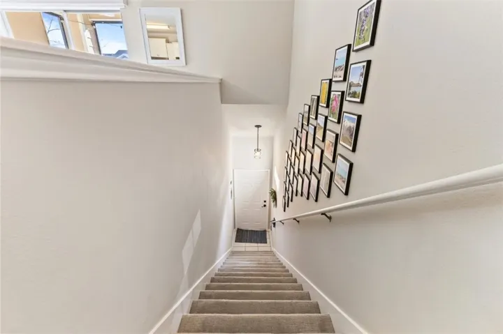 Front door on ground level, stairs come up to living space.