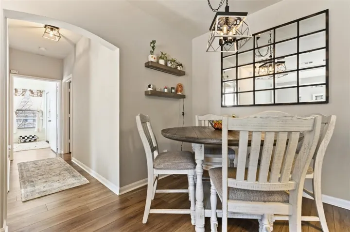 Dining area and hallway to bedrooms 2 and 3.  Notice the beautiful oak LVP flooring throughout the unit.