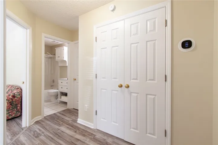 Hallway from foyer to Bedrooms 2 & 3, Bath 2, large linen closet