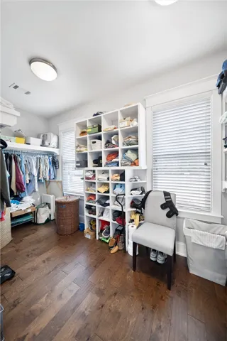Custom wood closet shelving in Primary