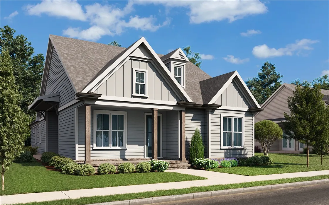 This charming residence features a well-manicured lawn and a welcoming porch, perfect for enjoying peaceful afternoons.