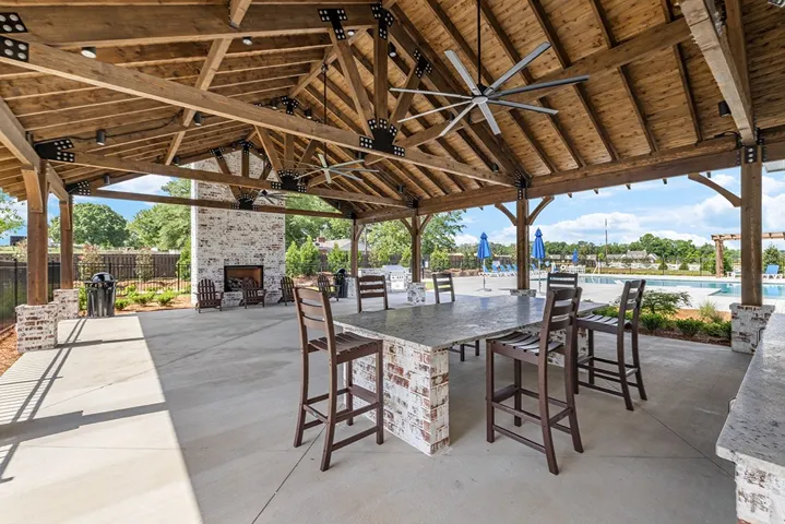 This inviting outdoor space offers relaxed entertainment, combining comfort with scenic views for memorable gatherings.