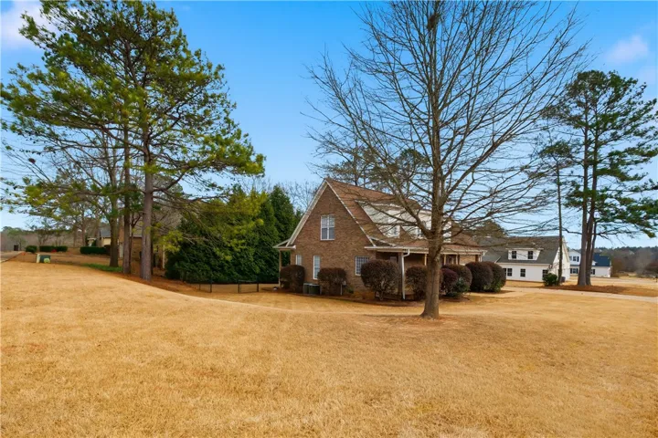 The corner lot offers quite a bit of side yard beyond the fence.