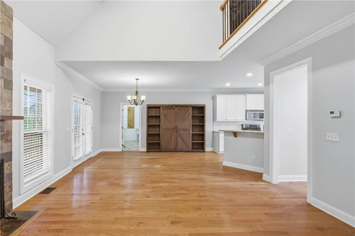 Catwalk overlooking the living room draws the eye upward and enhances the open feel.