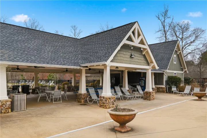 Community pavilion offers shaded seating and a convenient place to congregate near the pool.