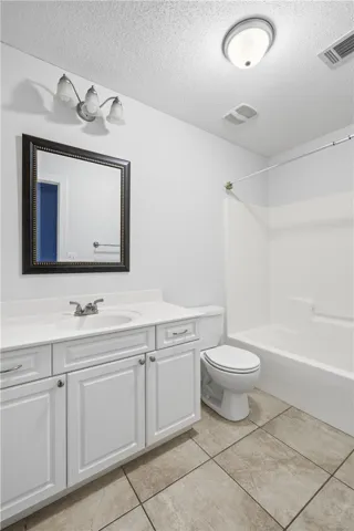 Second-floor bath with a spacious vanity, tub/shower combination, and convenient access from both bedrooms.