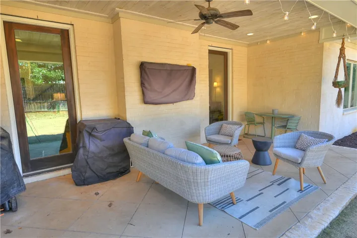 Covered back patio complete with recessed lighting & wired for tv.