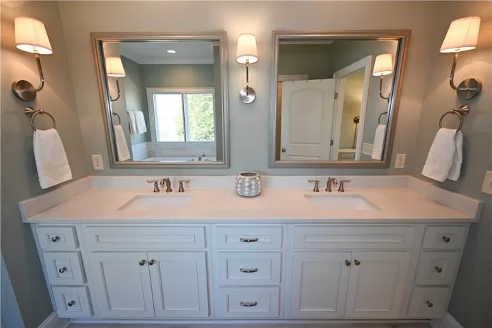 Double sink extended vanity with several sets of drawers to keep your counters tidy!