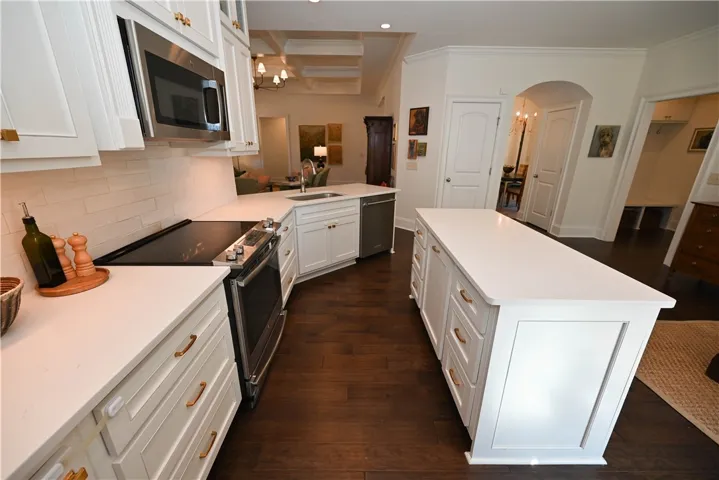 Kitchen complete with center island & quartz countertops
