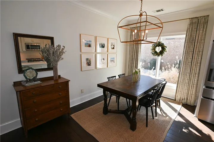 Bright breakfast area off the kitchen with large picture windows!