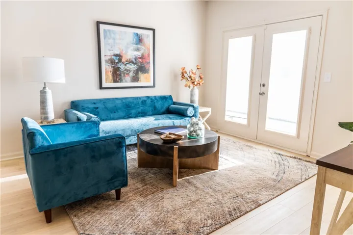 New paint & new LVP in Living room with porch entrance.