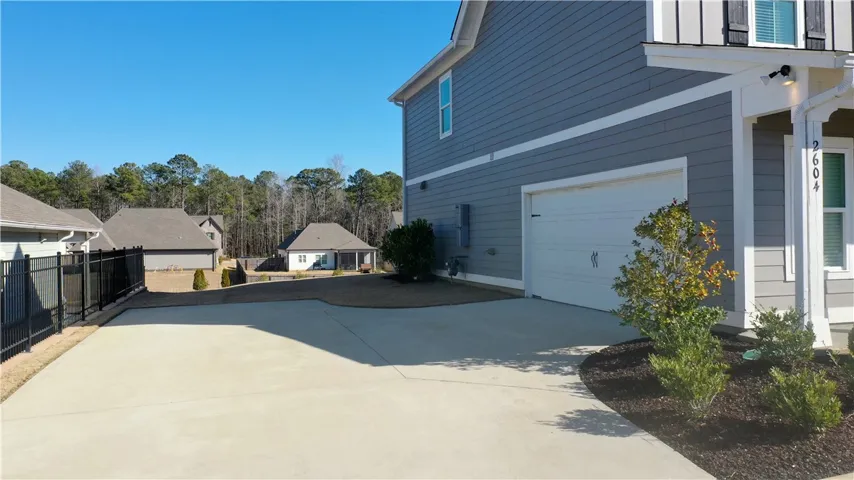 Extra Parking Pad and Double Garage