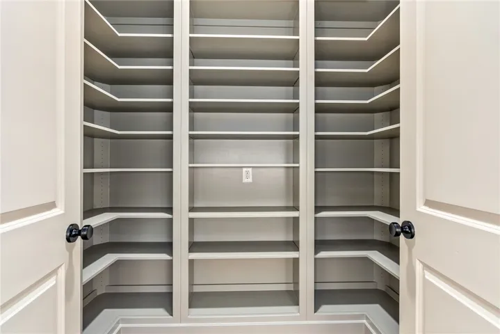 Ample built-in adjustable shelving provides generous storage space, perfect for organization.