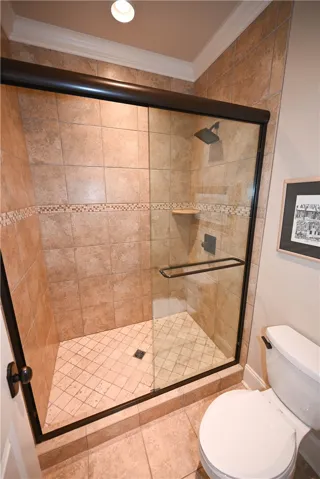 Separate shower area with glass/tile shower.