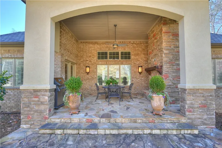 Includes a gas fireplace, gas grill line, and integrated TV wiring.