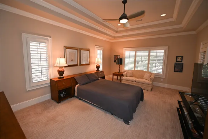Master suite with tray ceiling.
