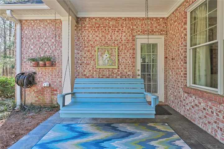 Covered back porch to enjoy your beautiful back yard