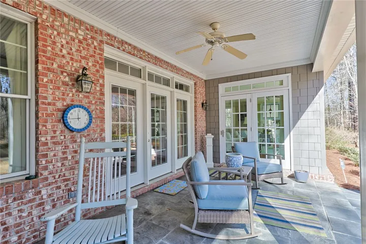 All sides brick and entrances to the porch from sunroom and living room