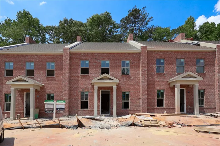 This newly constructed brick Condo features multiple units with classic architectural details and inviting entryways.