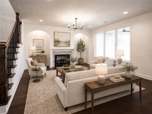 This inviting living area features warm flooring and a classic fireplace, perfect for relaxation and gatherings.