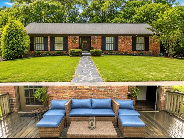 A classic brick exterior with dark shutters offers inviting curb appeal and a charming front path.