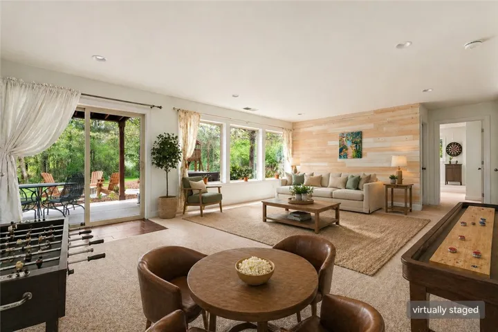 This versatile living space offers seamless indoor-outdoor living, perfect for relaxation and entertainment.