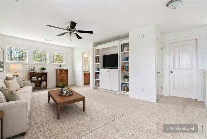 This bright living space offers comfort and built-in storage.