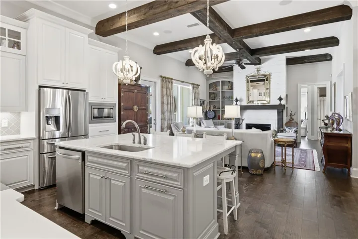 The kitchen is open to the great room and accessible from the foyer and dining room.