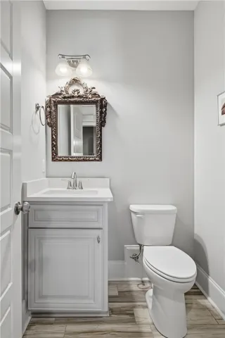 A second-floor half bath services the theater room.