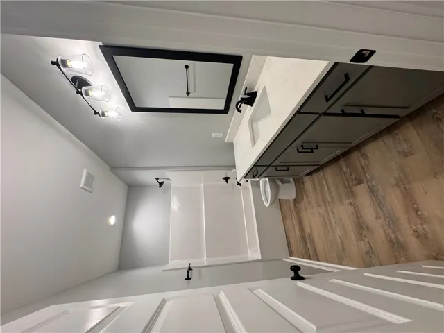 This newly renovated bathroom features modern fixtures and ample storage, providing a refreshing daily retreat.