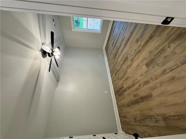 This interior space features durable flooring and a window allowing natural light to enter.