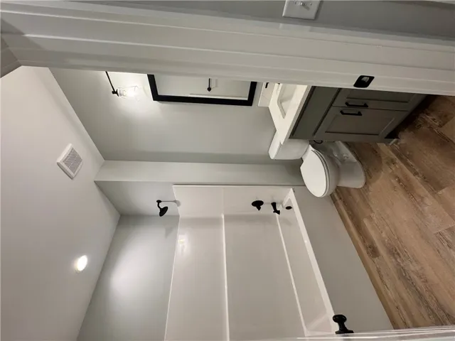 This newly updated bathroom features elegant fixtures and durable flooring.