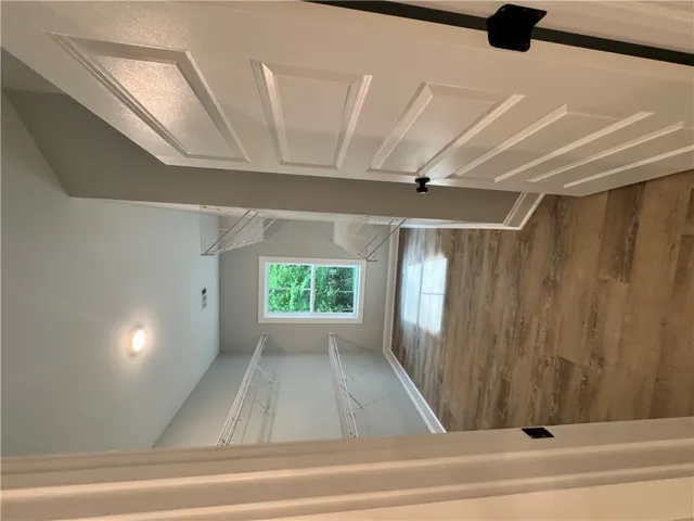 This spacious walk-in closet offers ample storage and natural light.