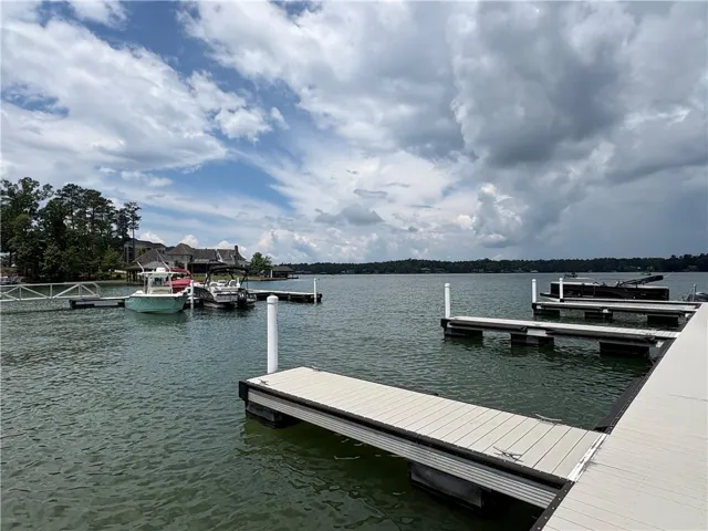 A private boat dock extends into the lake, offering convenient water access and picturesque views.
