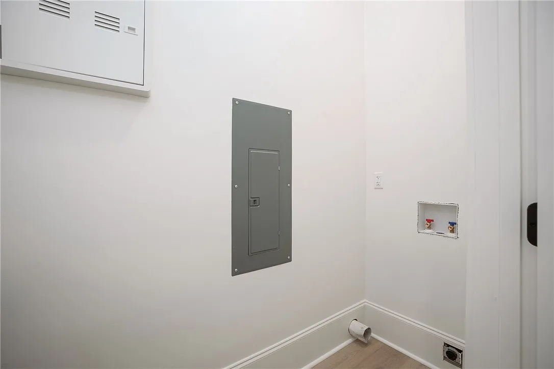 Ready for your washer and dryer, this dedicated laundry space offers convenience.