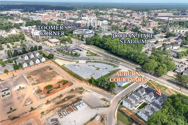 An aerial perspective showcases a vibrant urban landscape with prominent city landmarks and residential areas.