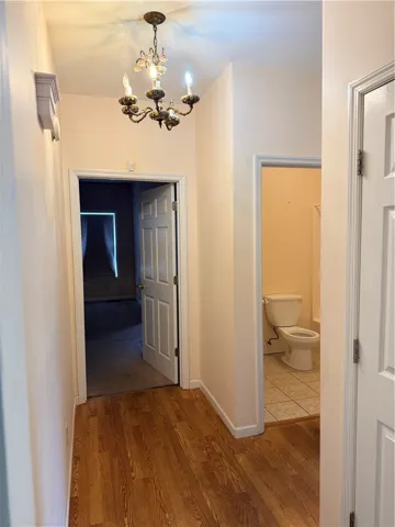 Hallway to Primary Bedroom and Bedroom 2, as well as guest bathroom 2