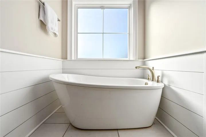 En suite with free standing soaking tub and walk-in shower