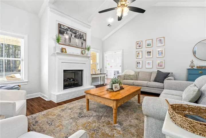 Spacious living room with vaulted ceiling and gas fireplace