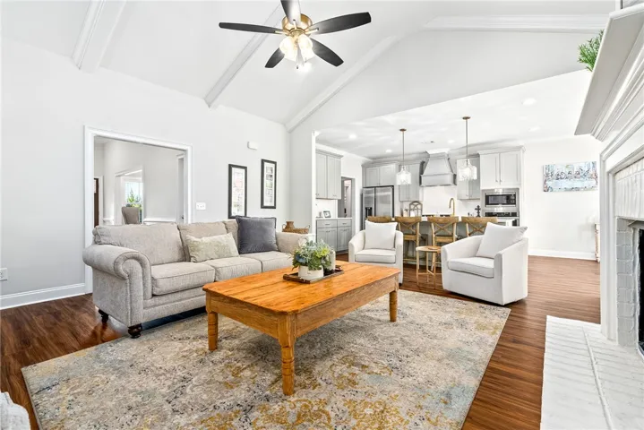 Spacious living room with vaulted ceiling and gas fireplace