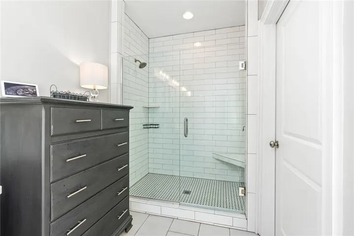 En suite with free standing soaking tub and walk-in shower