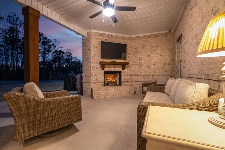 Covered back porch with wood burning fireplace
