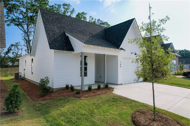 The Trace plan by Holland Homes LLC on lot 104. All plans, pricing, and specifications are subject to change without notice.