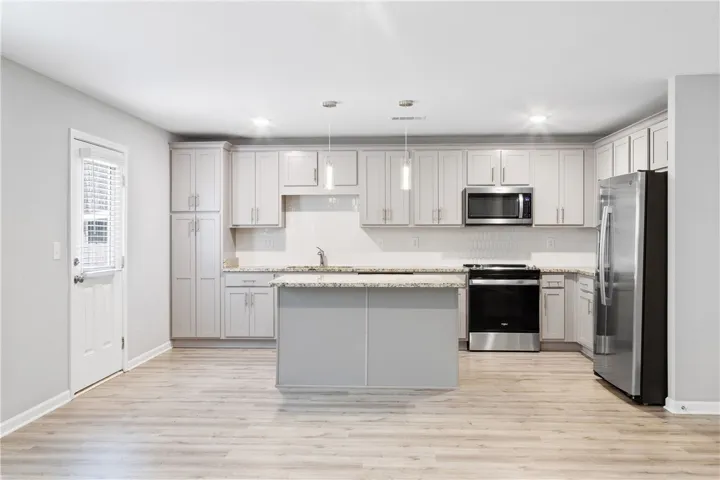 Open concept kitchen with granite countertops