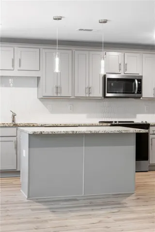 Open concept kitchen with granite countertops