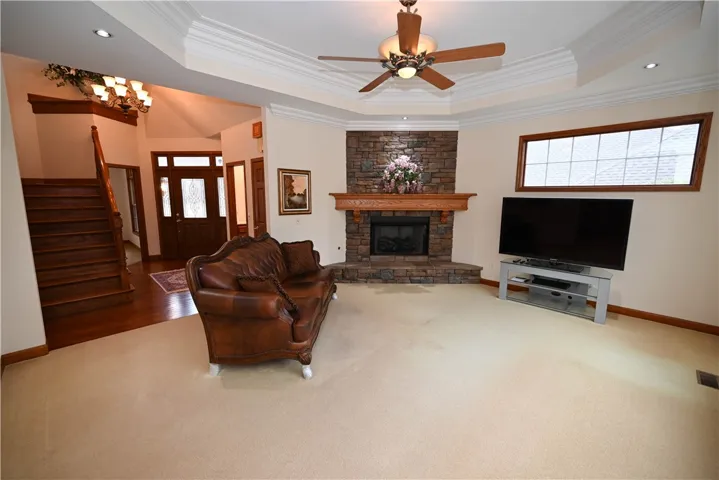 Cozy living room with gas fireplace & stacked stone hearth